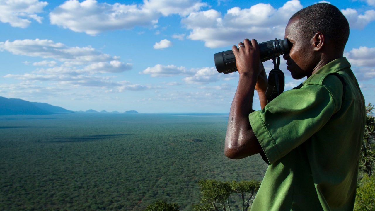 Man watching through binocular
