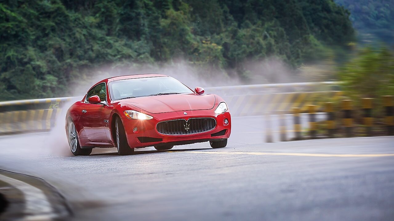 A red Maserati speeds uphill in the Shell Helix Ultra film We Know Why You Drive